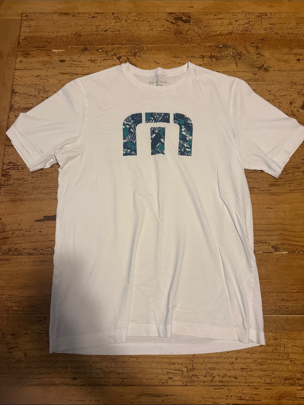 Travis Mathew White Short-Sleeve Tee with Teal Patterned Logo